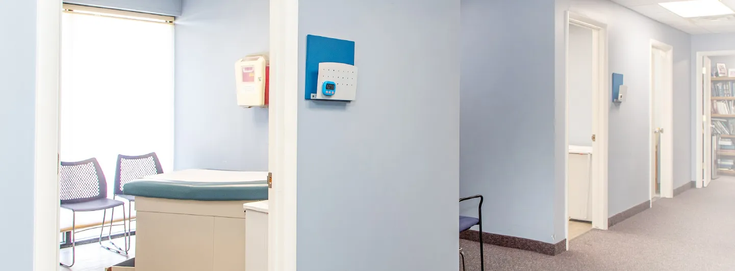 Bright exam room and hallway inside Warren Allergy & Asthma Care
